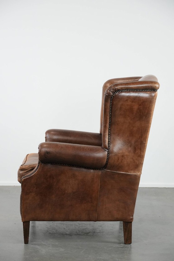 Image 1 of Comfortable vintage sheepskin wing chair with character