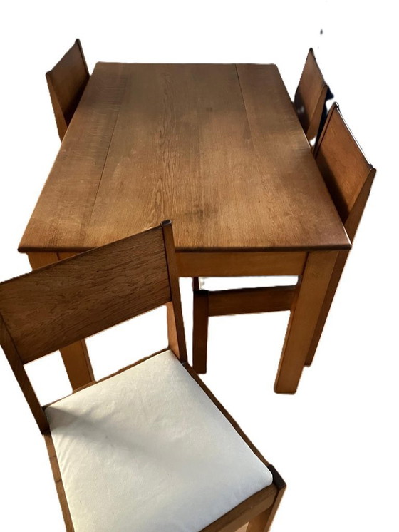Image 1 of 4 chaises de salle à manger et une table de l'usine de meubles L.O.V. d'Oosterbeek