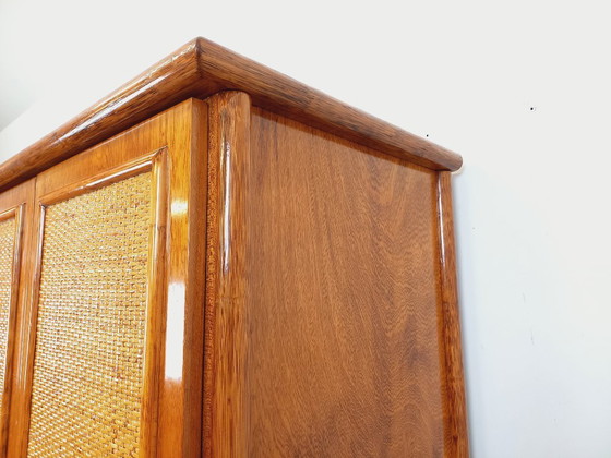 Image 1 of Armadio vintage Maugrion in rattan intrecciato e legno per Roche-Bobois, risalente agli anni '70.