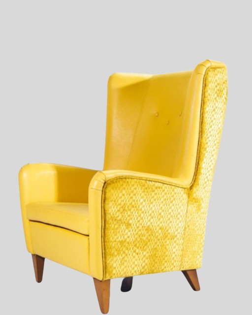Bellissima poltrona con braccioli in stile vintage del noto marchio olandese Satelliet.