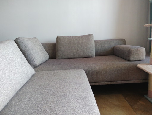 EYYE Ecksofa mit Hocker