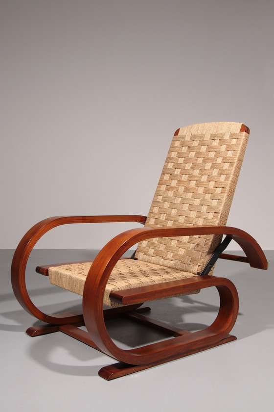 Image 1 of Een uitzonderlijk zeldzame mahoniehouten fauteuil gemaakt in Italië in de jaren 1950