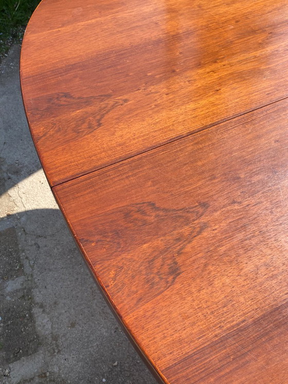 Image 1 of Baumann round oval extendable Scandinavian table in rosewood with 2 extensions, length 166 to 256cm, an60