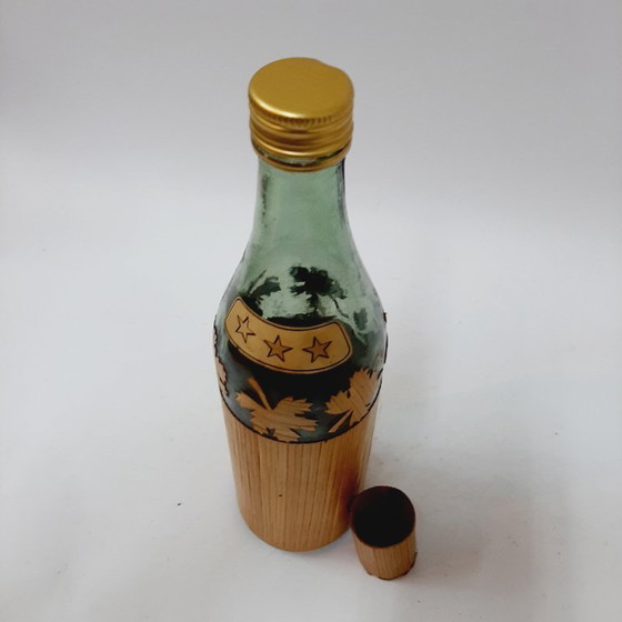 Image 1 of Vintage glazen fles omwikkeld met riet