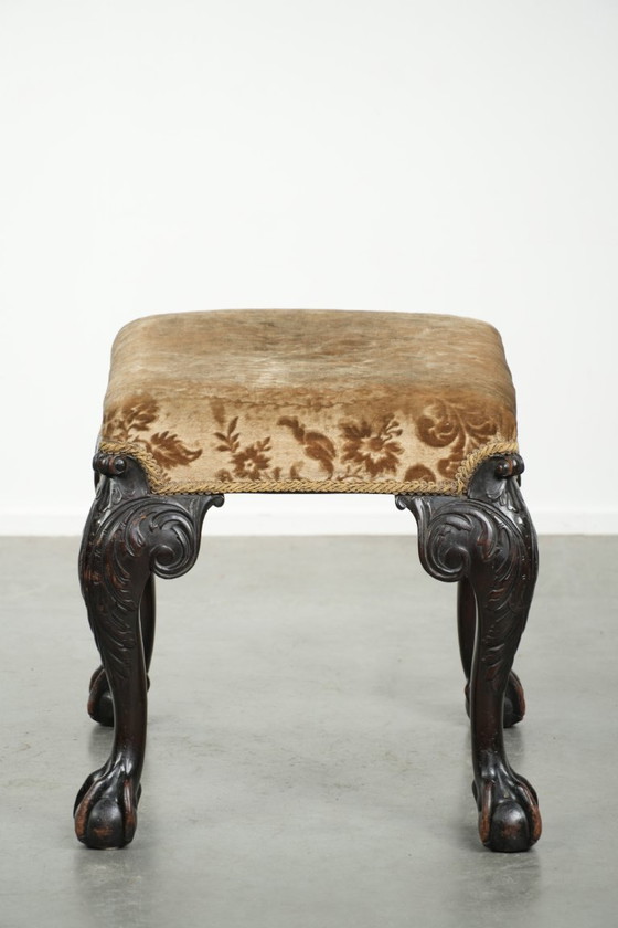 Image 1 of Antiek Hollands zitje/ hocker uit de 18e eeuw met velours stof, mooi houtsnijwerk en klauwpoten
