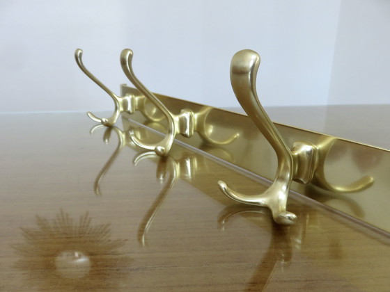 Image 1 of Large wall-mounted coat rack in gilded aluminum, France, 1970