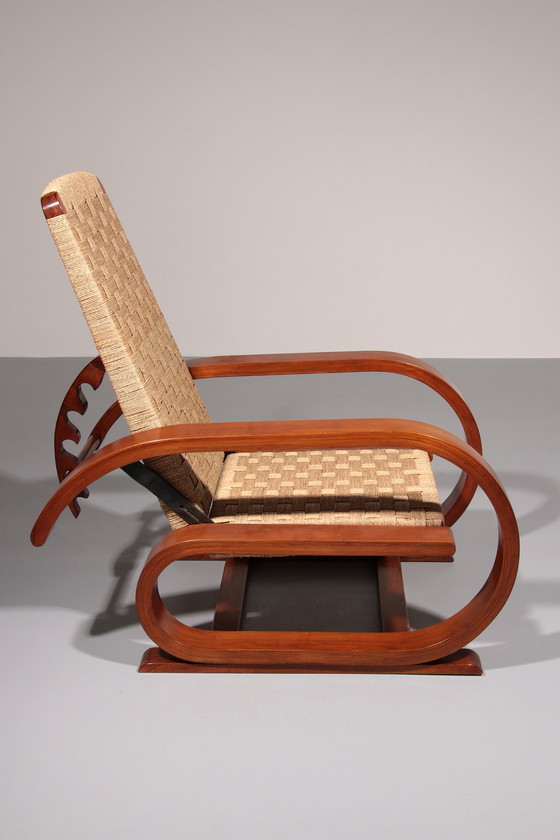 Image 1 of Een uitzonderlijk zeldzame mahoniehouten fauteuil gemaakt in Italië in de jaren 1950