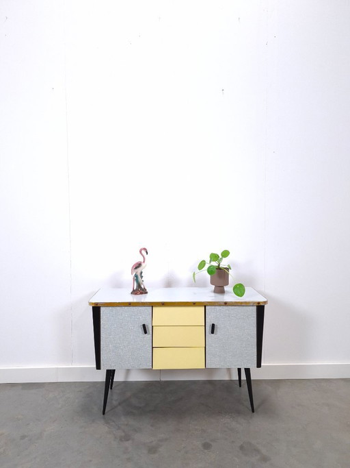 1950s light blue-yellow cabinet with Formica and slanted legs