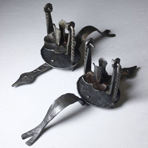 Pair of wrought iron castle-style wall sconces with candles, mid-20th century