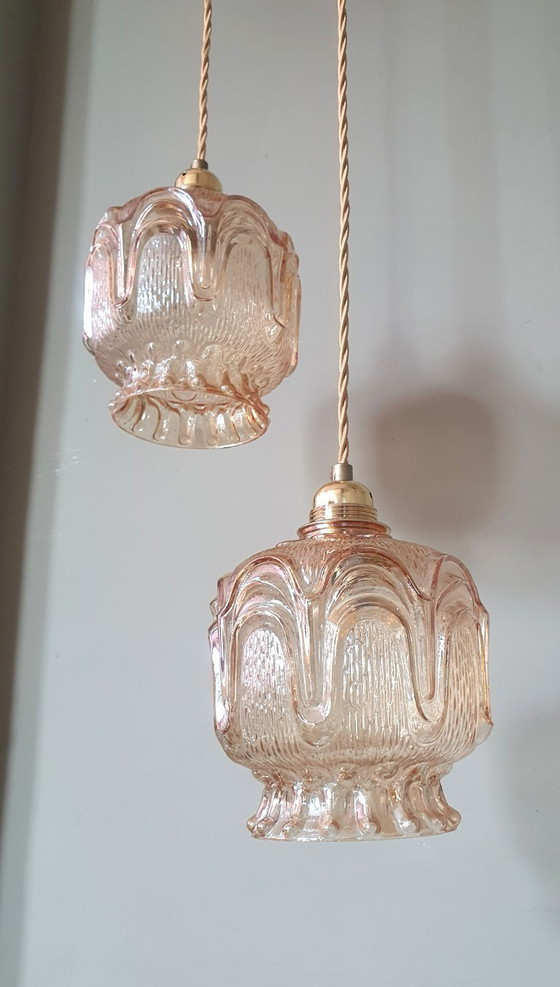Image 1 of Set of 2 Vintage textured rose / amber tinted pendant lamps - mid-century design.