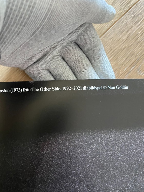 Image 1 of Nan Goldin, exibition poster  “This Will Not End Well” Naomi presenting a stage show, Boston (1973) fran The Other Side, 1992-20