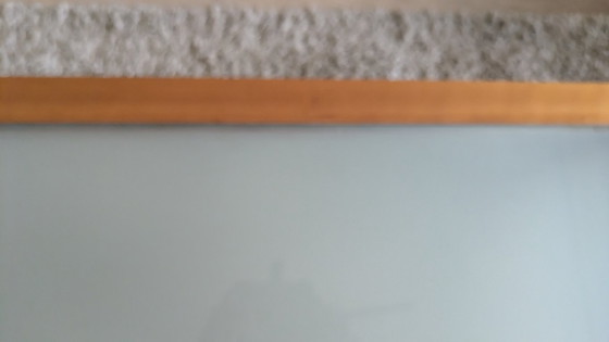 Image 1 of cherry wood red coffee table with sleek glass top from 1996