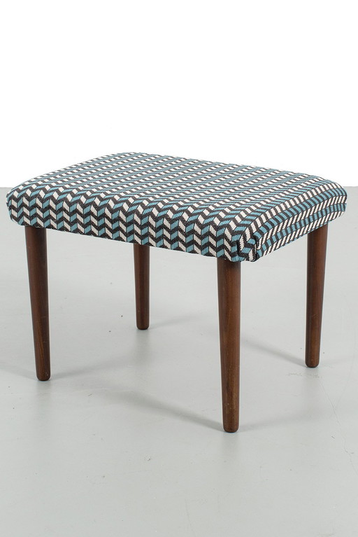 Footstool reupholstered with graphic pattern