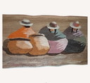 Hand-woven wall hanging in earth tones