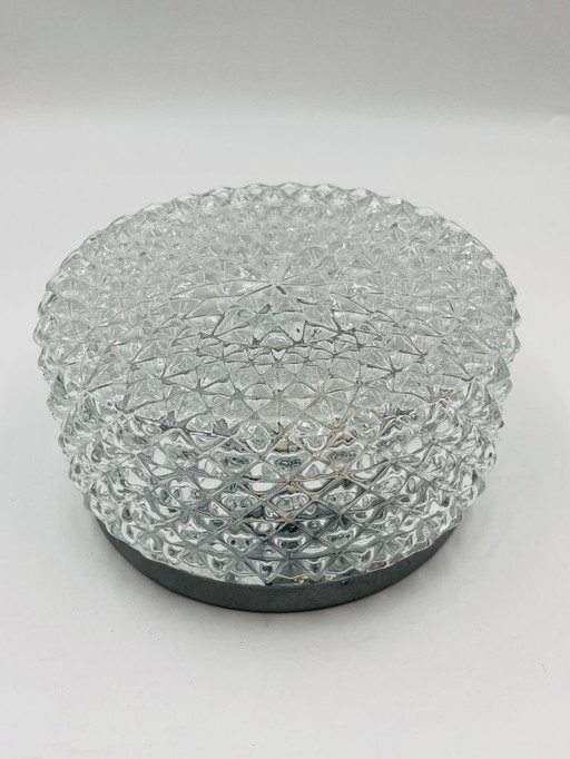 Moulded glass ceiling light with starburst decoration