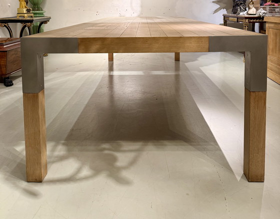 Image 1 of A large oak dining table, designed by Claire Bataille and Paul Ibens