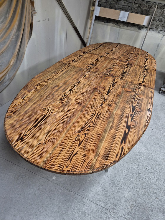 Image 1 of Oval dining table with burnt wood top