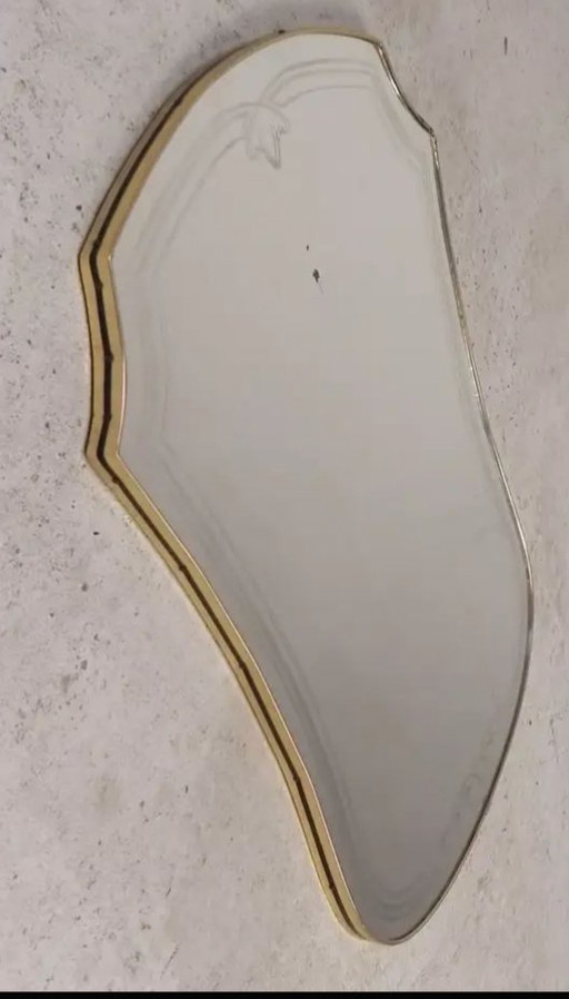 Antique-style wall mirror by Gio Ponti.