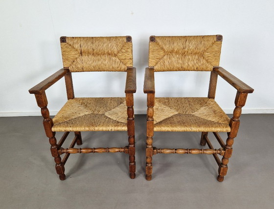 Image 1 of Vintage Franse Armleuningstoelen | Eiken en Riet