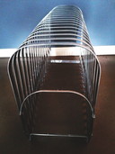 Harmonica magazine rack