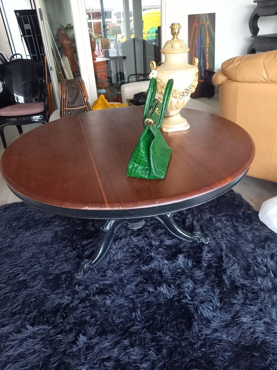 Image 1 of Antique round table on wheels