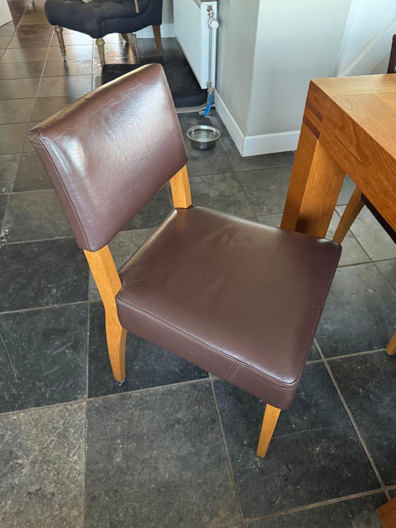 Image 1 of Wooden table with 8 chairs