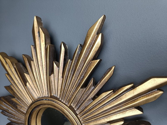 Image 1 of Beautiful resin sunburst mirror with convex mirror glass.  The golden mirror is in a good condition.  1960s - made in Belgium.  