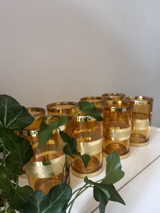 Image 1 of Set of 8 gold/amber colored glasses