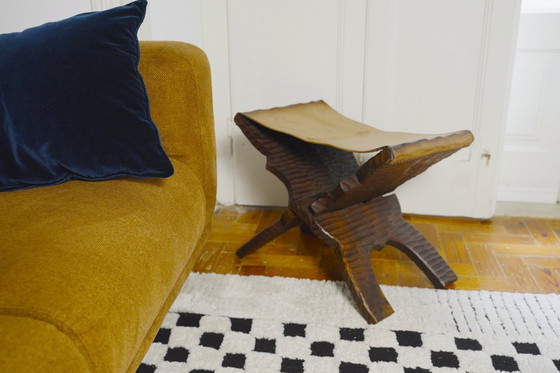Image 1 of Brutalist Folding Stool Leather Sling Seat Hand Carved Wood X Frame 1950s Rustic Mid Century Ottoman