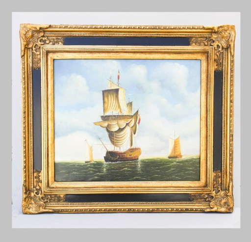 Tableau ancien représentant un navire en mer. Cadre baroque d'origine.