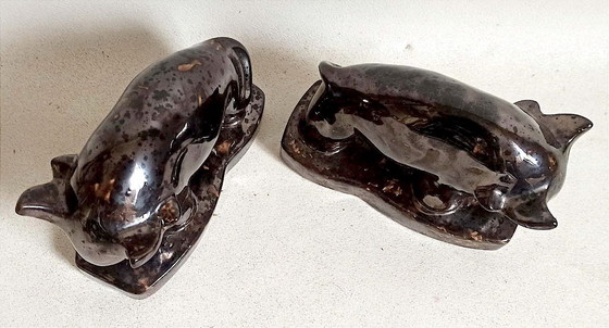 Image 1 of Een paar boekensteunen uit de jaren 60 met een gestileerd stierenontwerp.