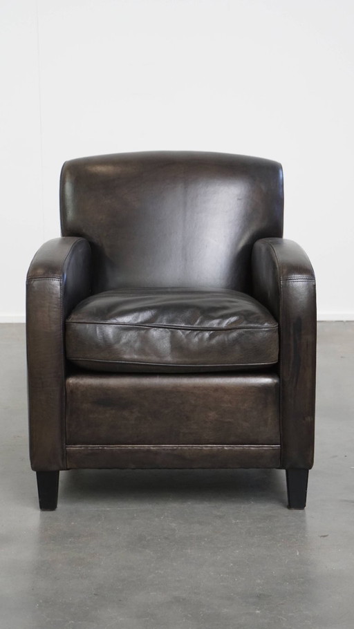 Zwart/ grijze design fauteuil/ armchair gemaakt van schapenleer