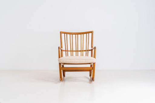 Fauteuil à bascule « ML33 » de Hans J. Wegner pour A. Mikael Laursen (Danemark, années 1950).