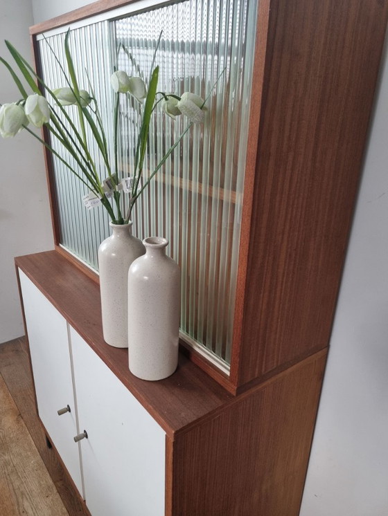 Image 1 of Set of two vintage cabinets with ribbed glass – warm wood & white (mid-century look)