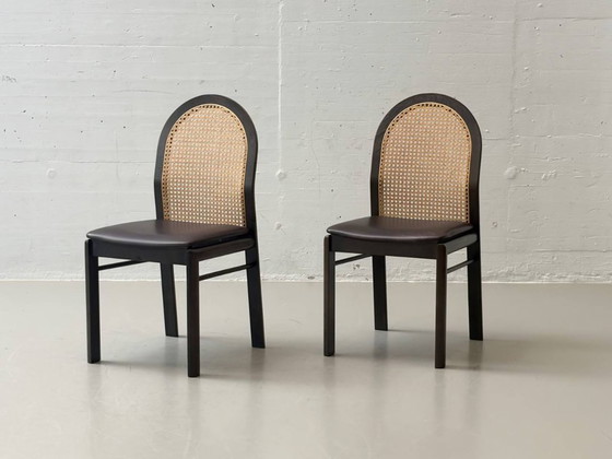 Image 1 of Set van 6 stoelen met rieten en lederen zittingen van Dietiker, jaren 80.