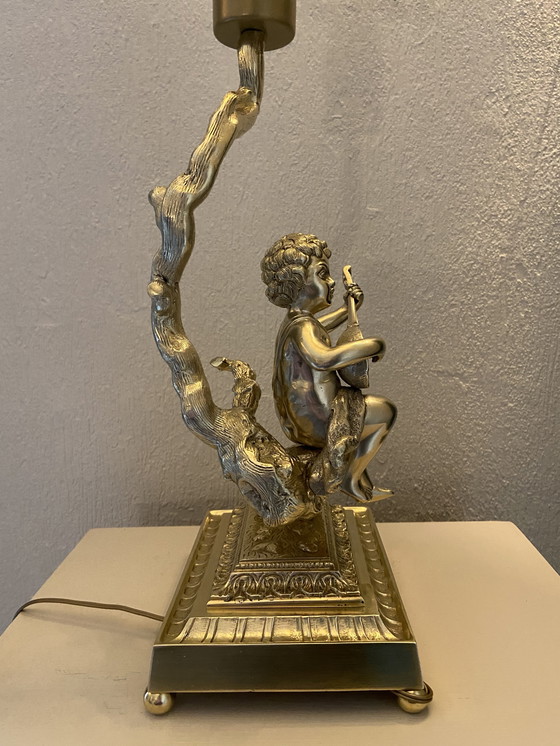 Image 1 of Bronze table lamp depicting a cherub playing the guitar
