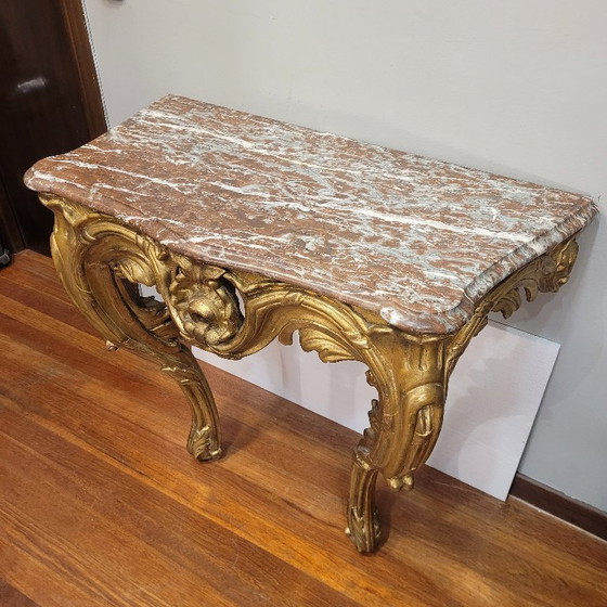 Image 1 of Consolle a muro, in legno intagliato e dorato, stile Luigi XV, XVIII secolo – Francia