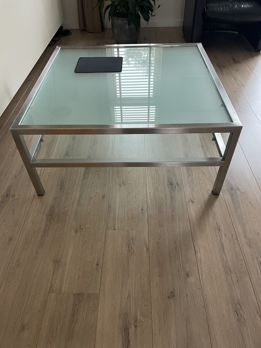 Tavolino da caffè in vetro con struttura in acciaio inox