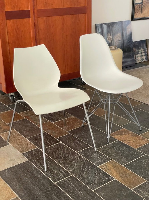 Two designer chairs (Vitra and Kartell), white