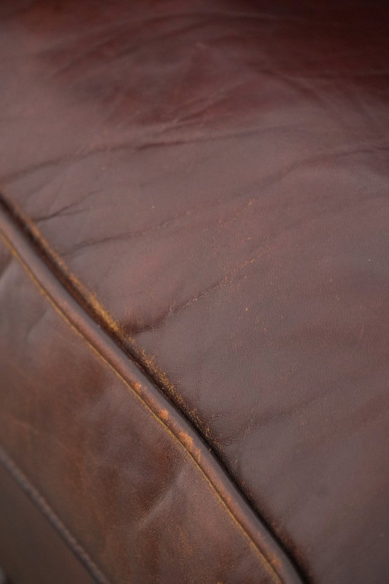 Image 1 of Vintage clubfauteuil gemaakt van schapenleer met siernagels