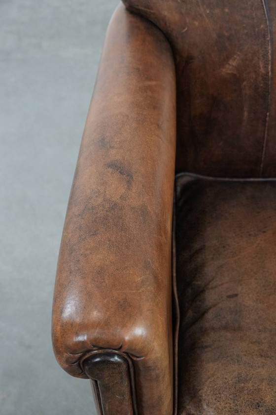 Image 1 of Vintage schapenleren fauteuil met een karaktervolle uitstraling