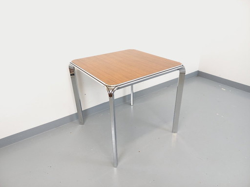 Tavolo da pranzo quadrato vintage Pierre Paulin in palissandro e metallo cromato degli anni '70