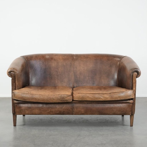 Vintage 2-seater sofa made of cognac-colored sheepskin in English style