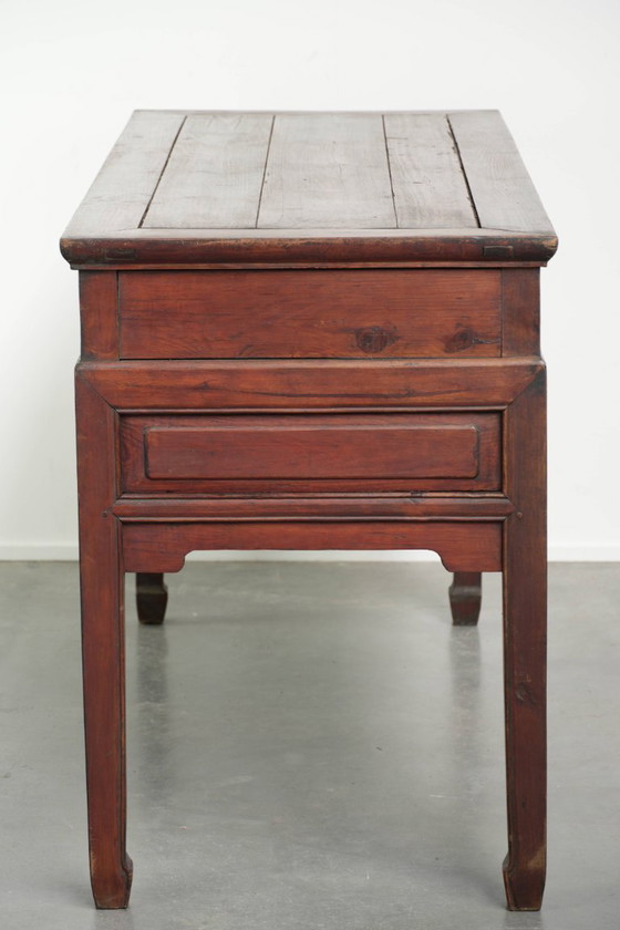Image 1 of Antique wooden Chinese sideboard from the late 19th century in a beautiful red color with exquisite wood carving.