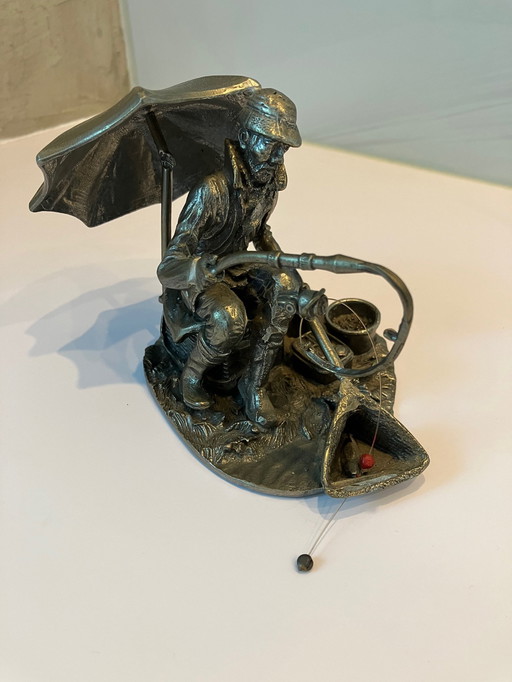 Tin Statue of a Fisherman