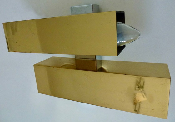 Image 1 of A brass wall lamp, in a minimalist, geometric style, from the middle of the last century.
