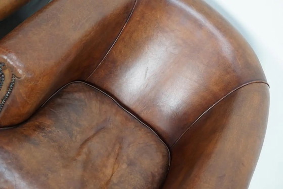 Image 1 of Vintage Nederlandse leren clubfauteuils in cognackleur, set van 2 met voetenbank