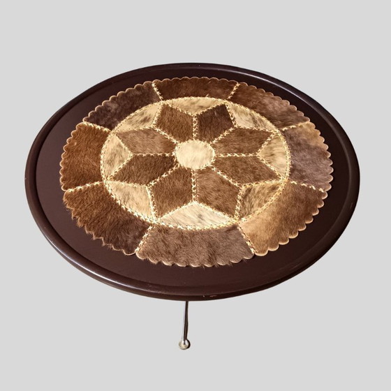 Image 1 of Vintage round coffee table with loose patchwork of cowhide