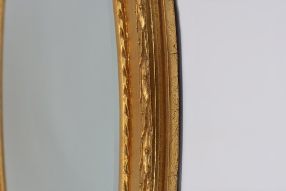 Image 1 of Oval shaped carved gilded Baroque mirror with beveled glass, Belgium  