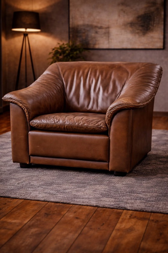 Image 1 of Pair of mid‑century brown leather club armchairs in good condition with small signs of aging and blemishes